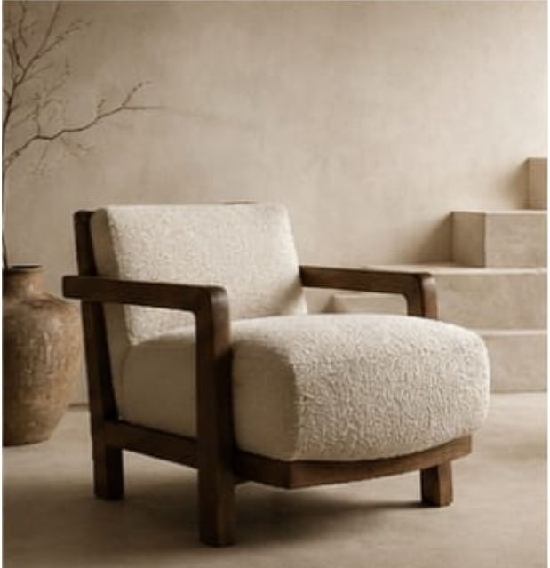 Boucle armchair with teak frame in minimalist interior