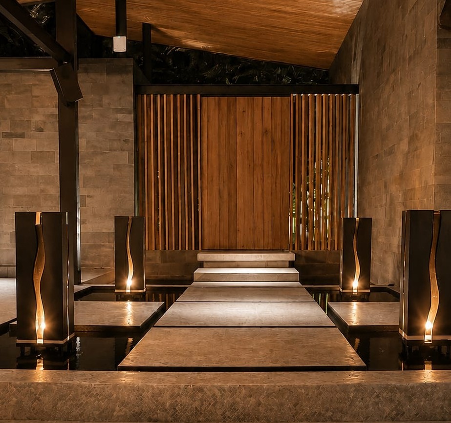 Warm metal architectural accents with candlelight in tropical pavilion